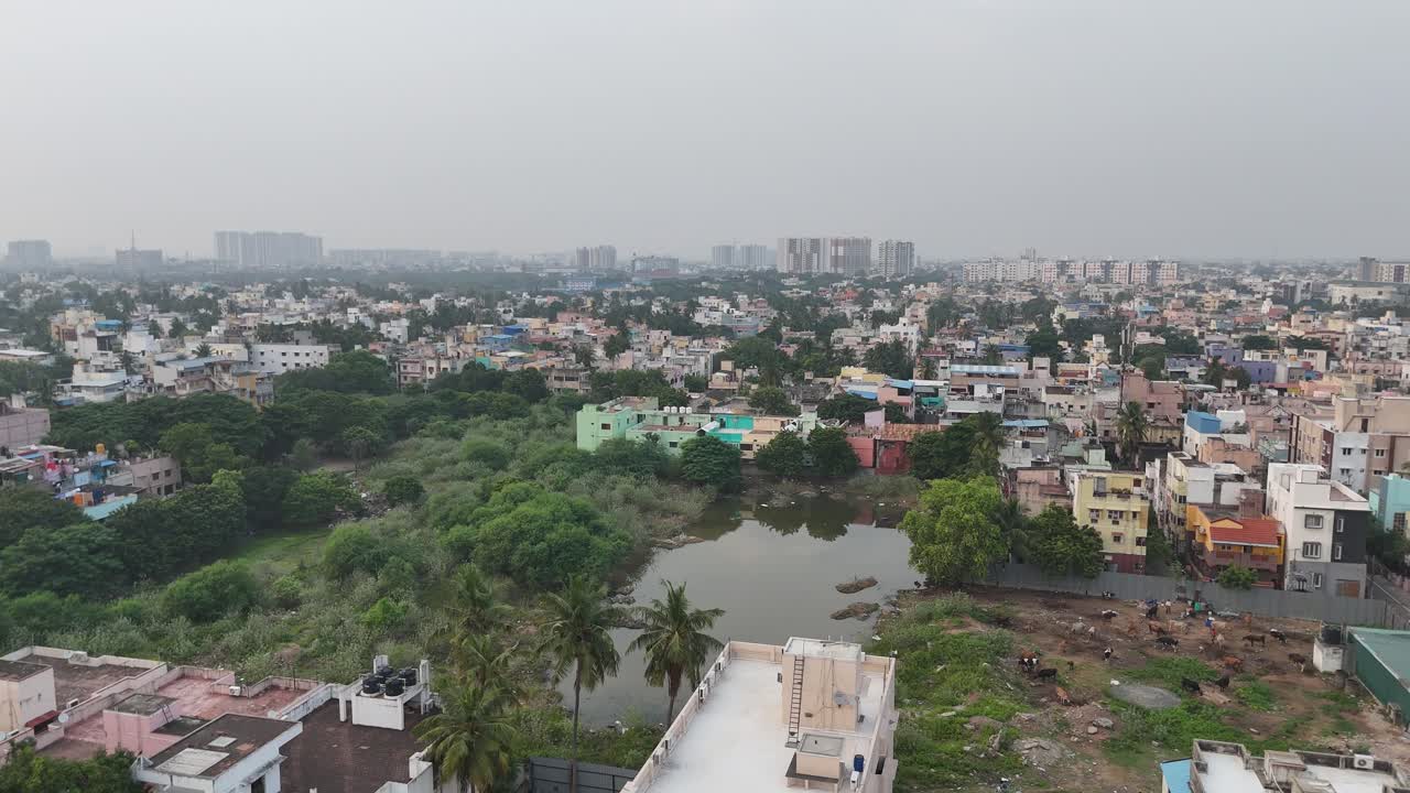 Aerial Drone shot of Chennai city with a Small Building in a congested area.