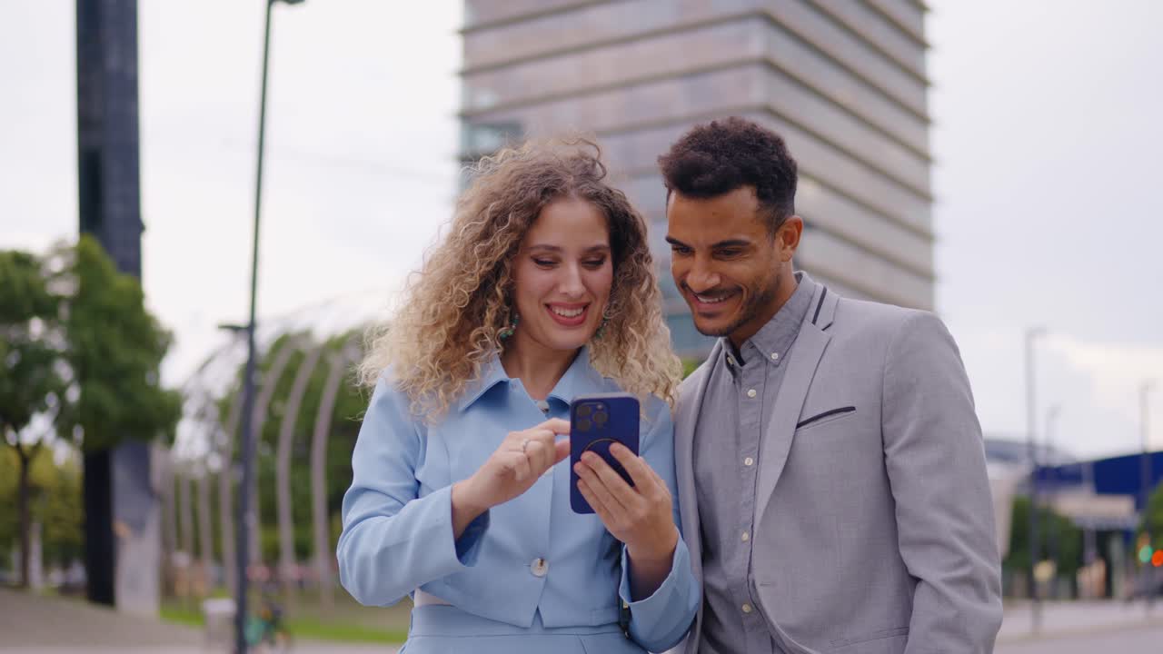 People looking at phone in the city