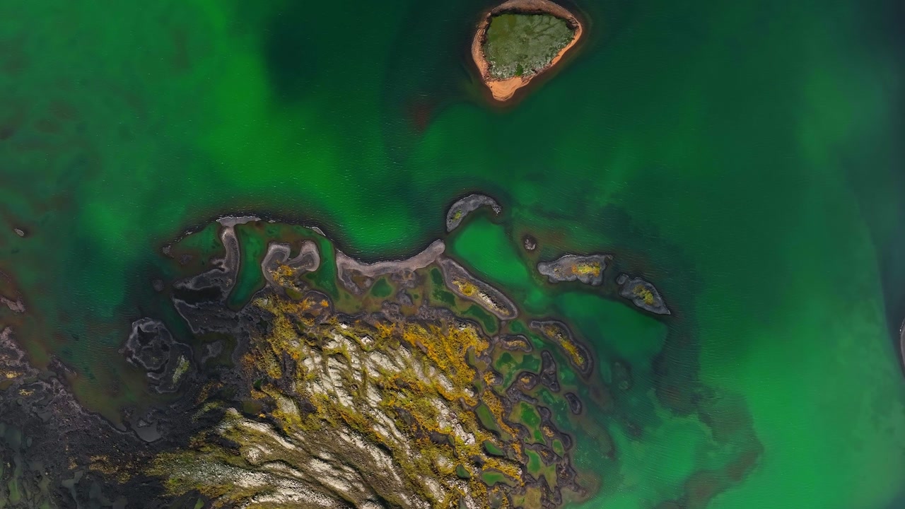 Out of this world turquoise lake. Distant planet concept. Lava rock formations in Iceland.
