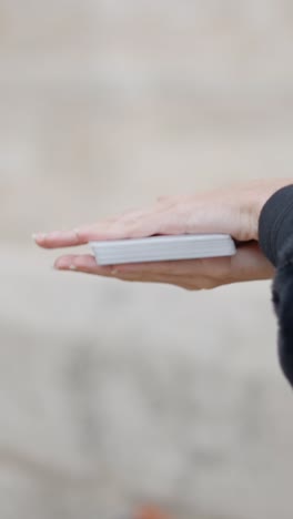 hands interacting with a deck of playing cards