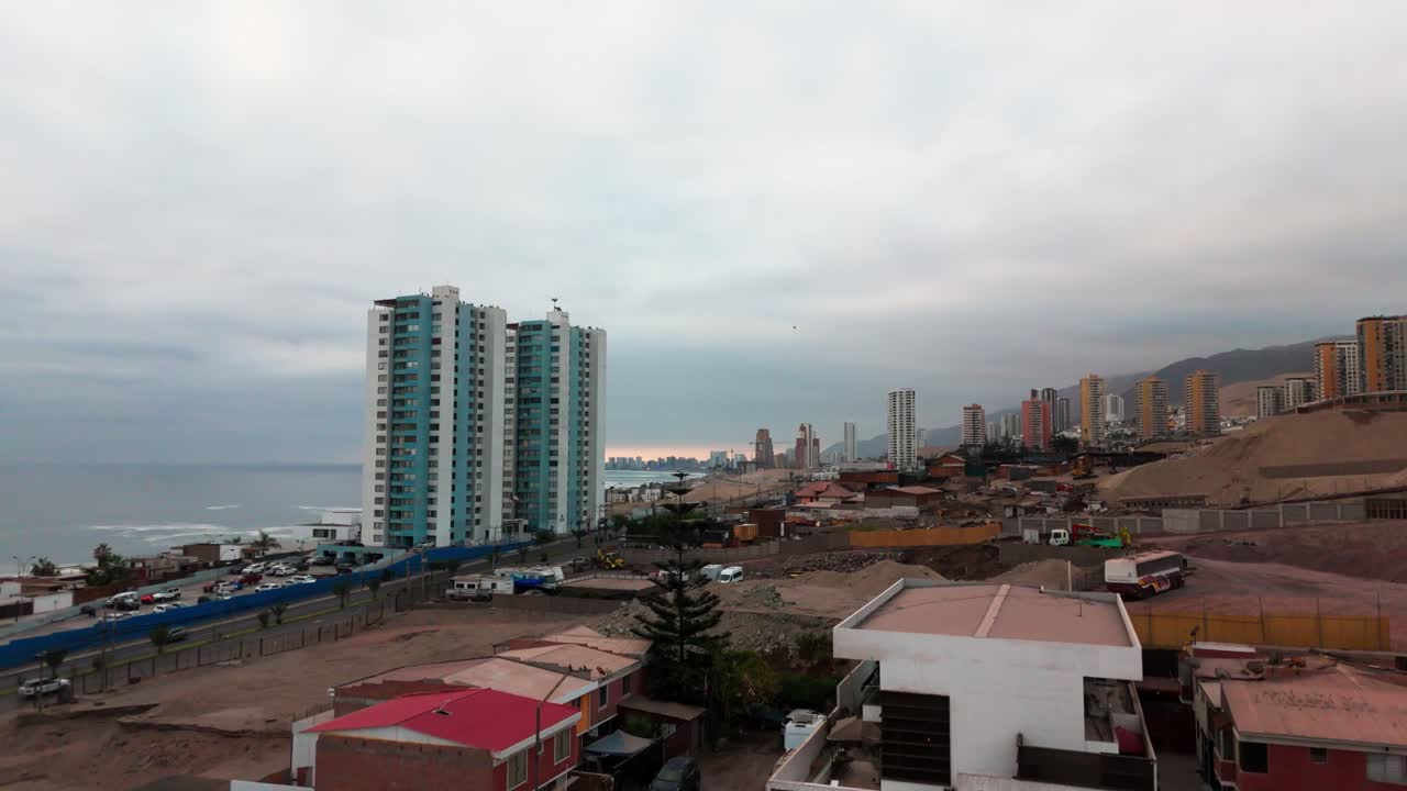 Iquique Chile Tarapaca Mountain Huayquique suburban sea ocean waves sand dunes buildings
