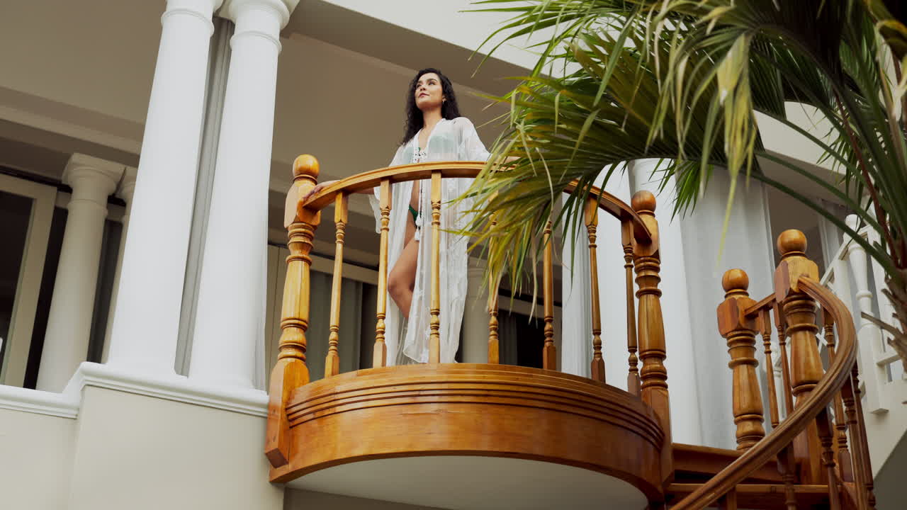 Woman on a Balcony at a Resort