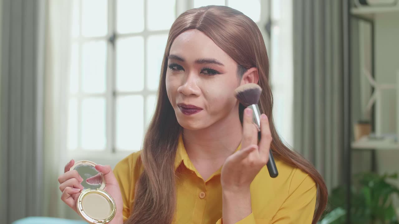 Influencer Young Transgender Woman Blogger Talks About Makeup. Blogger Talks Facial Beauty Treatments. Vlogger Broadcasts How To Use Of Cosmetic In Home Studio