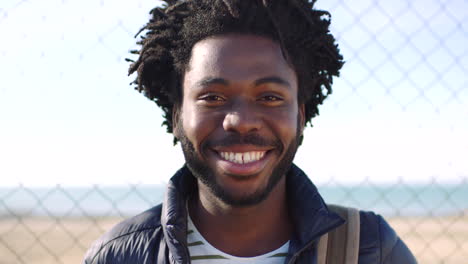 closeup portrait of a young black man laughing