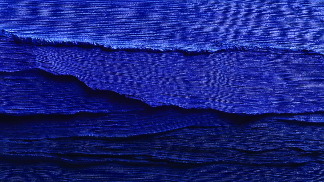 A stunning abstract representation of blue tones showcasing rich textures and layered brush strokes, evoking a sense of depth and artistry in the interplay of light and shadow