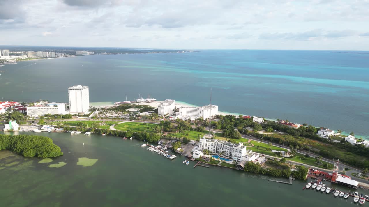 Cancun's hotel zone at playa langosta with nichupte lagoon and resorts, aerial view