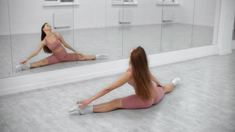 woman stretching in a dance studio