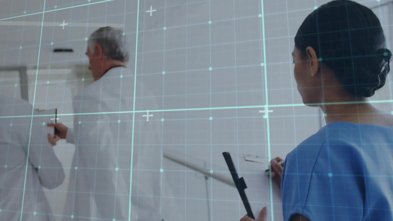Doctors reviewing patient care chart while walking hospital corridor, nurse following jotting notes