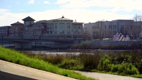 the napa valley, downtown napa on a regular commute day of cars passing by on a bridge low shot