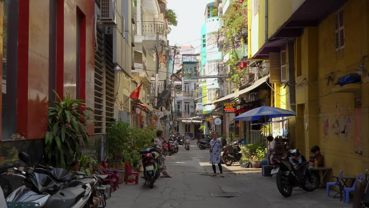 Wander through the lively back alleys of Ho Chi Minh City, witnessing local people engaging in their daily routines. Experience the vibrant culture and unique atmosphere of this bustling city.