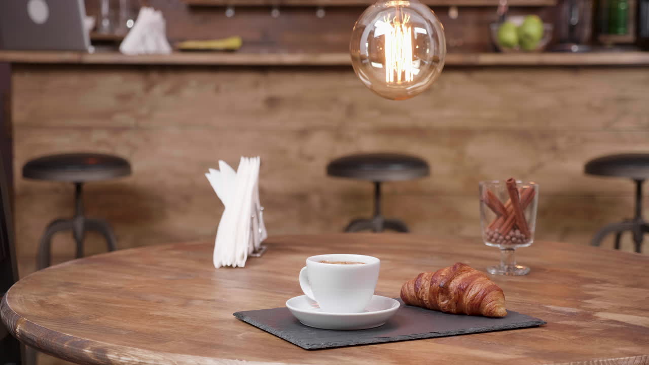 Coffee and croissant at cafe