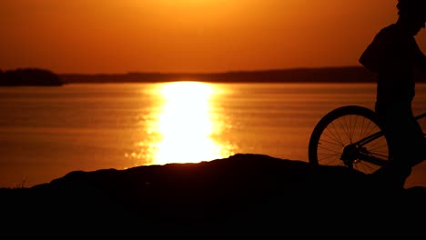 man with bike outdoor. athletic male tourist going downhill with mountain bike