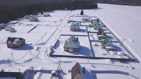 snowy village homes aerial view