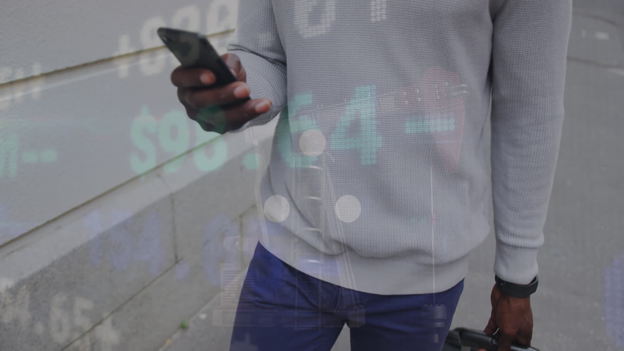 Black man navigates city street while engaged with his smartphone.