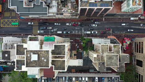 top view of cars and pedestrians on bustling city street in hong kong