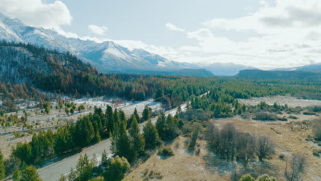 winter aerial view of andean forests and snow-capped mountains in chubut province, argentina, ecotourism