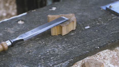 wood chisel on wooden block