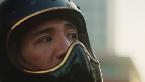 close-up of a person wearing a motorcycle helmet