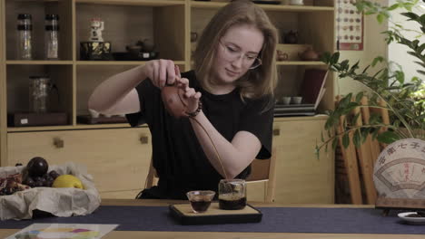 woman pouring tea