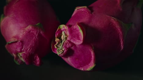 dragon fruit macro close up spinning on a plate with a dark background