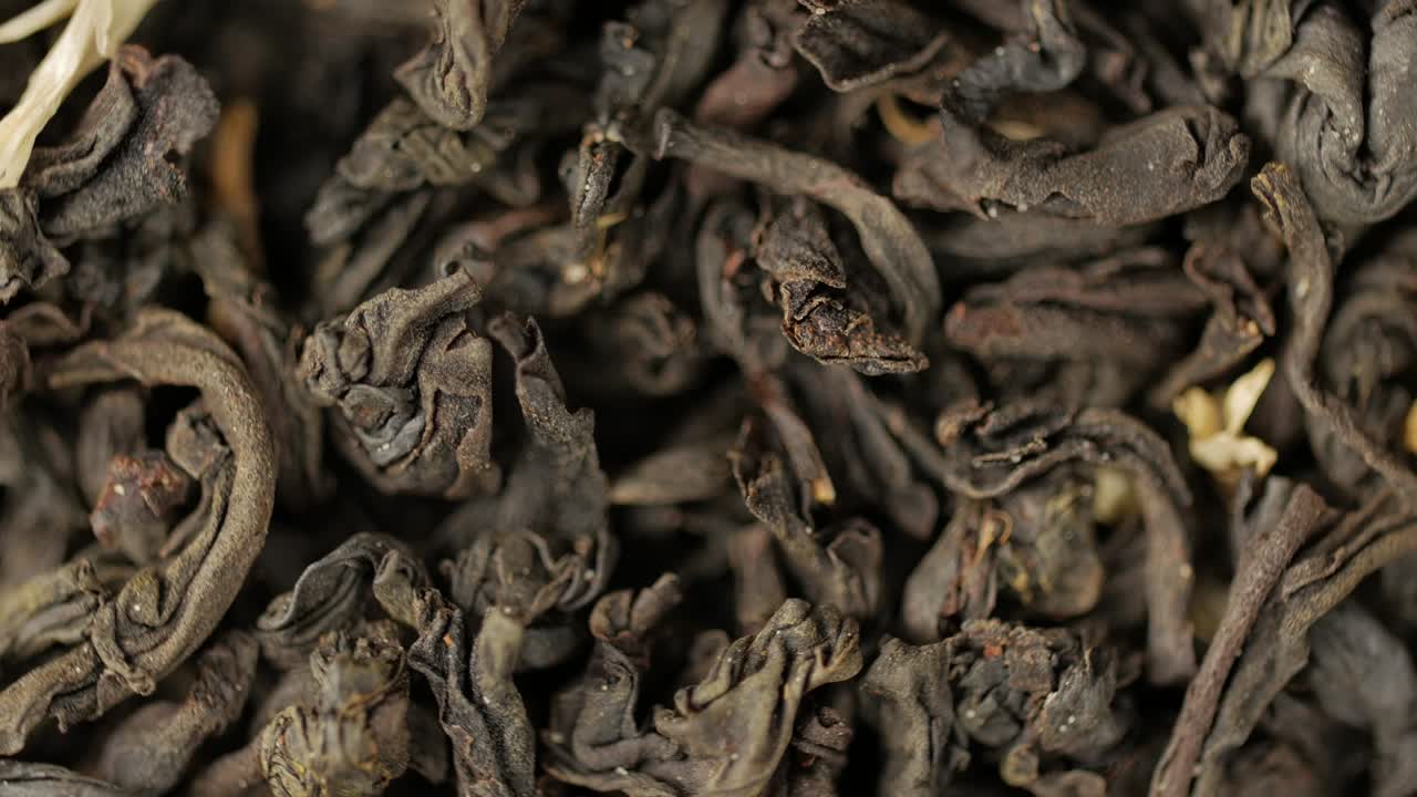 Black tea leaves close up. Loop rotation