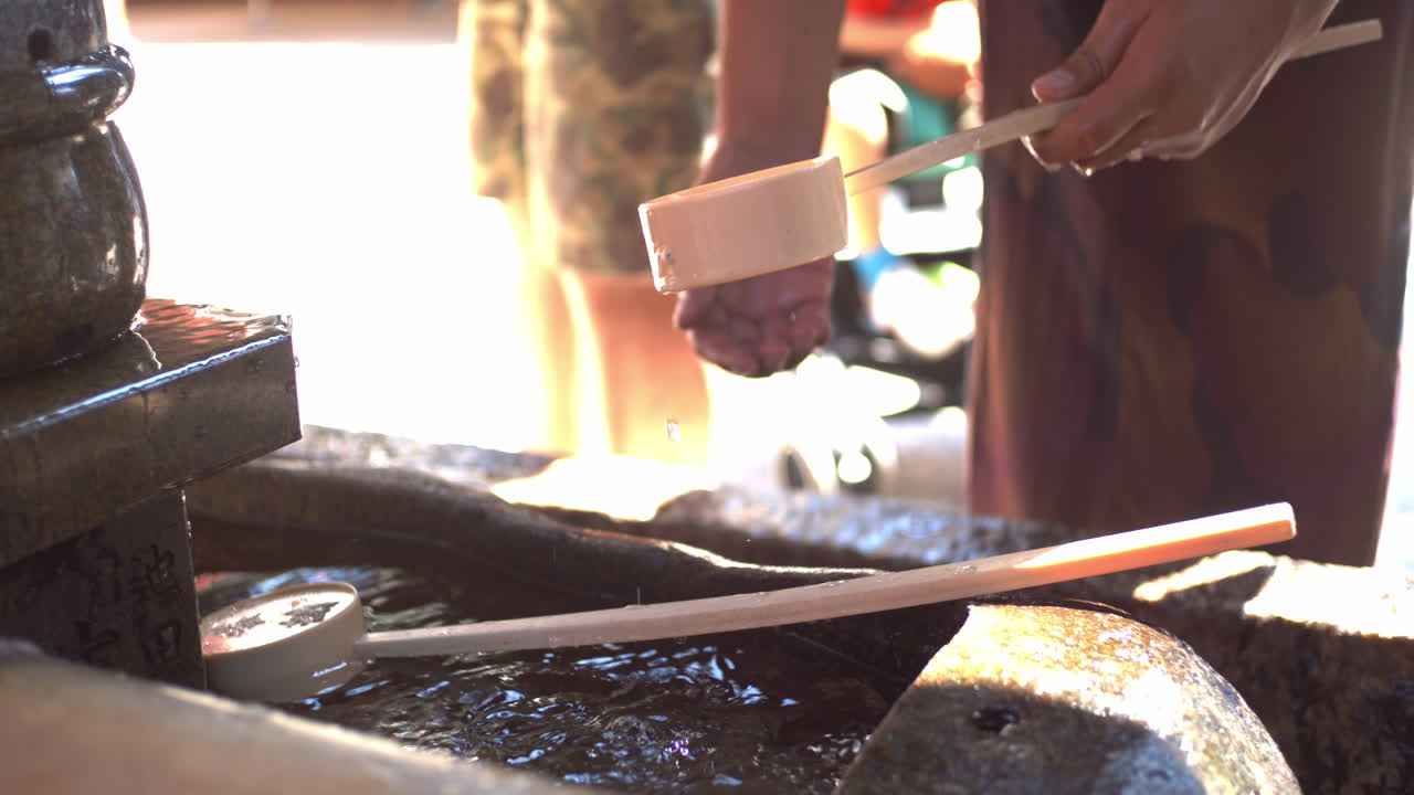 Traditional Japanese Water Purification Ritual at a Temple