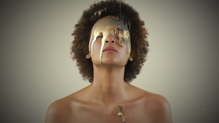 Woman with Gold Paint Dripping on Face