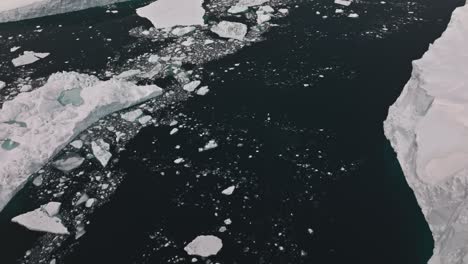 drone over sea and ice of ilulissat icefjord