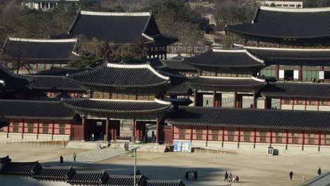 People-wearing-masks-visiting-Gyeongbokgung-Palace,-Seoul,-Seoul-Korea-top-view-during-covid-19-pandemic