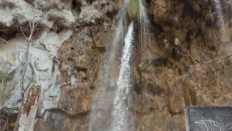 Waterfalls-crash-over-the-edge-of-mossy-mountain-sides-at-Plitvice-National-Park-in-Croatia