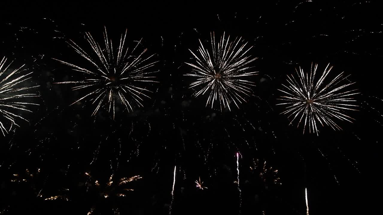 4K long time seamless loop of real colourful fireworks festival in sky display at night during national holiday, new year party 2022