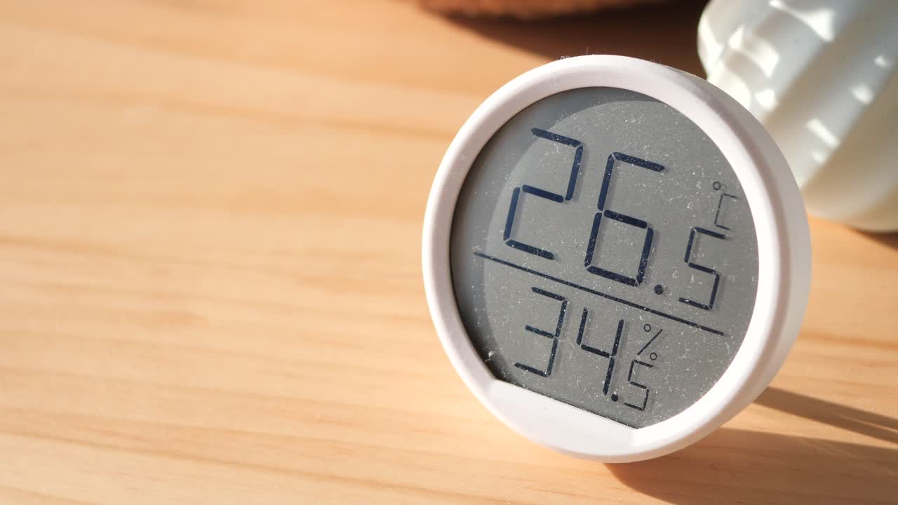 Digital Thermometer and Hygrometer on Wooden Table