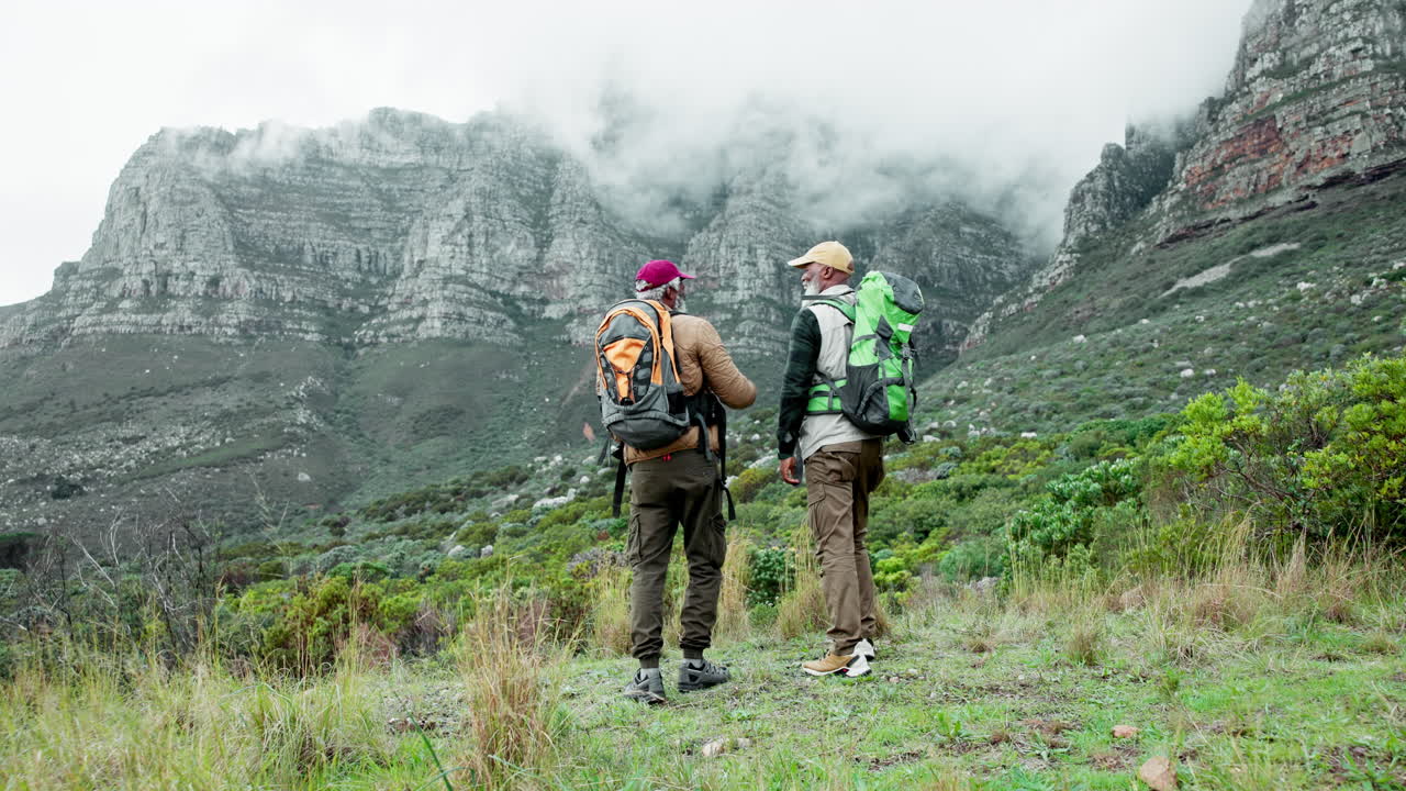 Two Senior Men Hiking in the Mountains