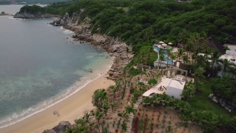 Aerial-of-landscape-along-the-mesmerizing-coastline-in-Huatulco,-Mexico