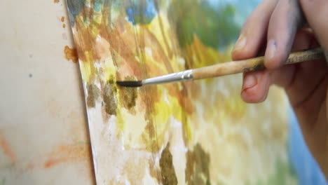 child painting a watercolor