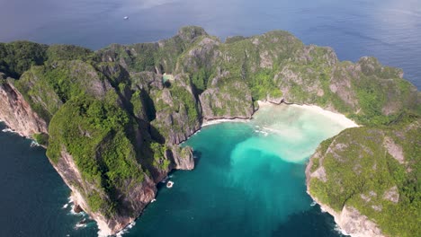 aerial 4k drone video of phi phi leh with maya bay and pileh lagoon, krabi province, thailand. aerial top view of amazing tropical island with turquoise water and white beach, famous destination.