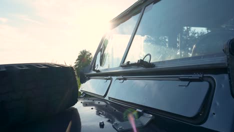 vintage land rover at sunset