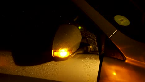 Rainy-night-side-view-of-car-door-opening-in-the-dark