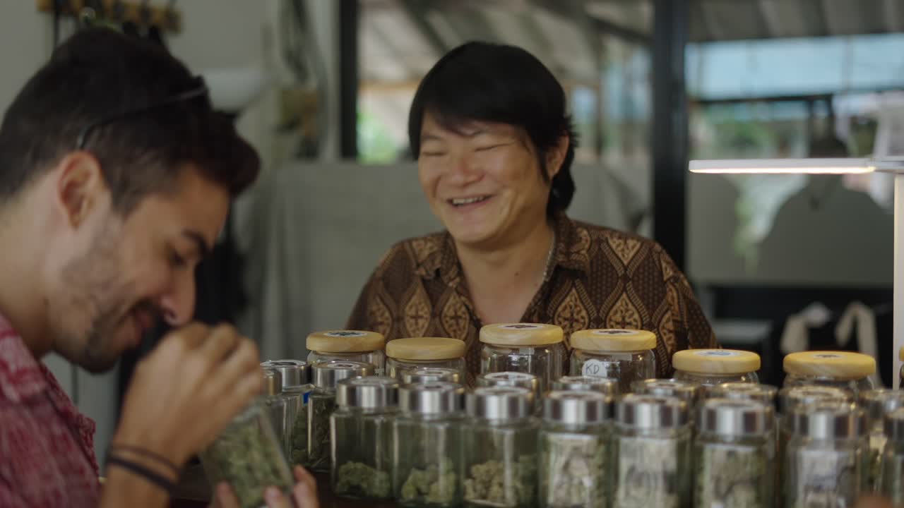 Customers examining cannabis products in a dispensary