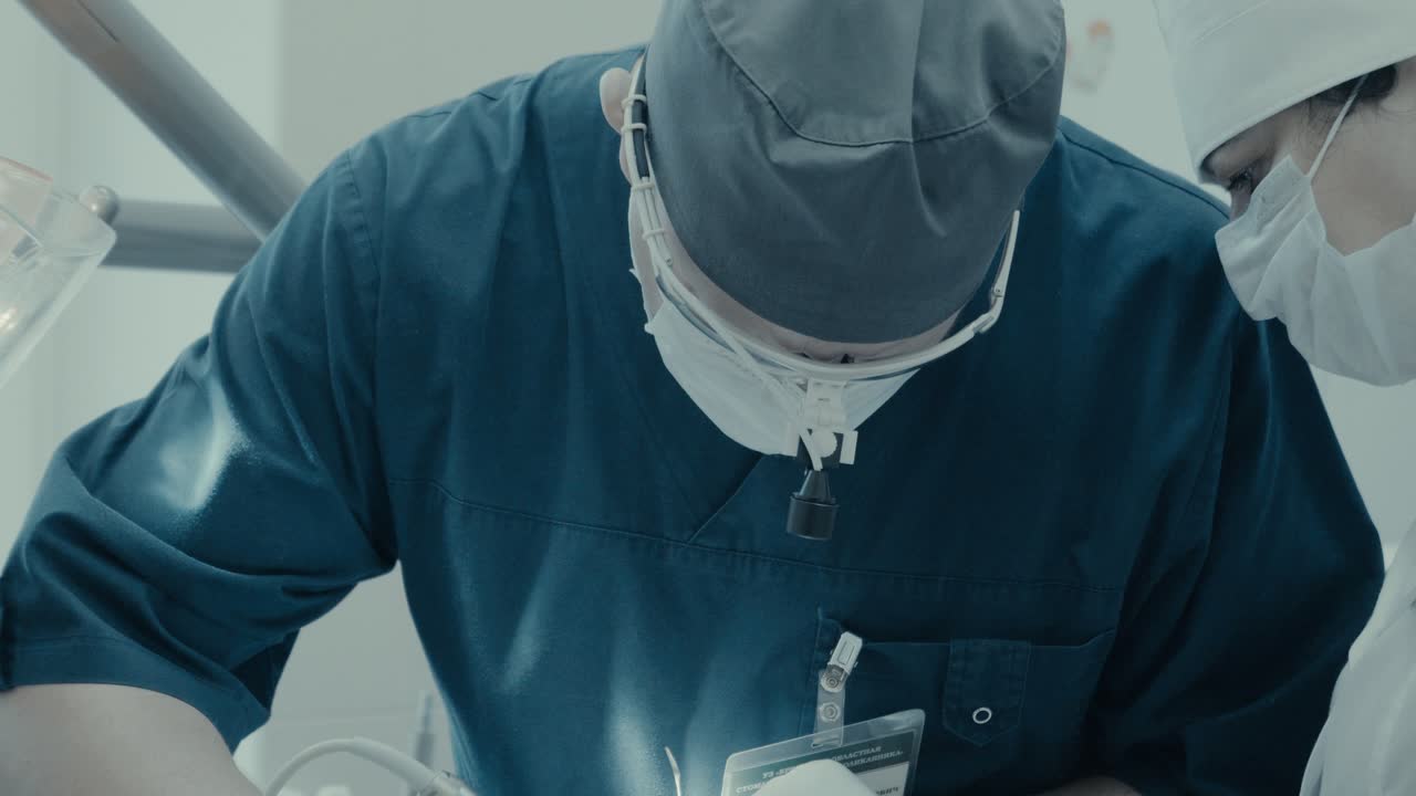Dentist surgeon does the surgery