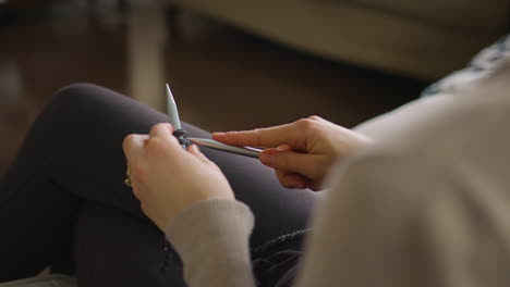 woman knitting. close up, over the shoulder