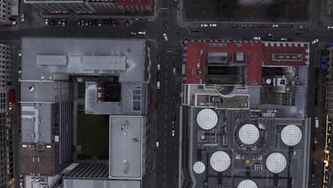 Aerial-birds-eye-overhead-top-down-view-of-blocks-of-buildings-in-town.-Cars-driving-in-streets.-Berlin,-Germany