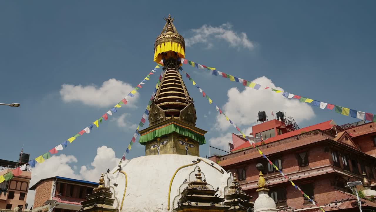 Old Historic Buildings in Kathmandu, Buddhist Temple in Nepal at a Famous Landmark in Kathmandu for Buddhism with a Clear Blue Sky on a Sunny Day
