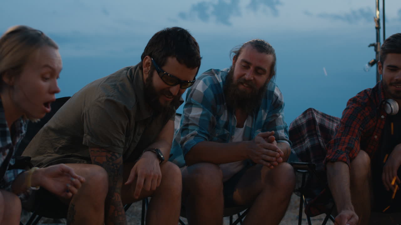 Friends Camping at Night