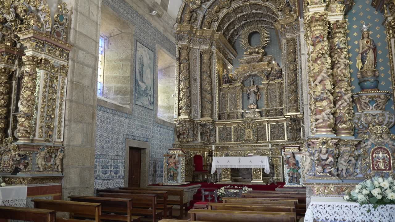 elaborate Baroque church interior with golden altars, intricate carvings, and wooden pews
