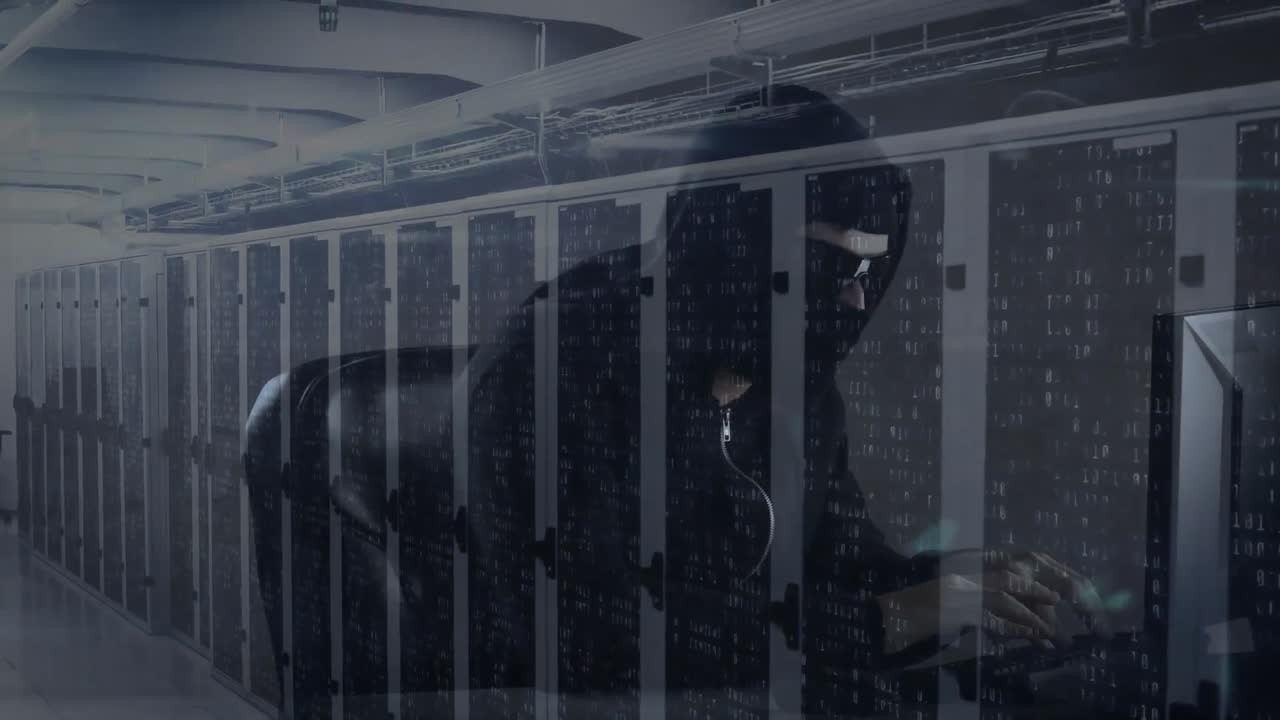 Animation of hooded man hacking computer