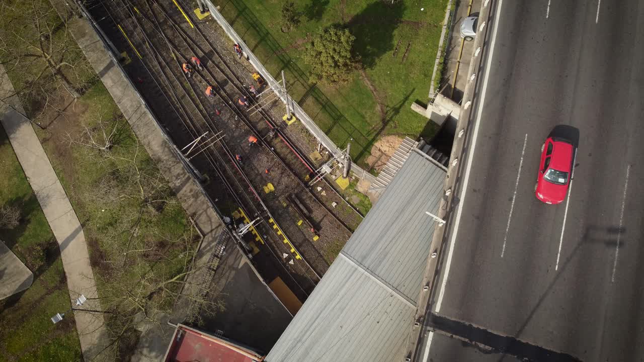 Railroad workers repairing the tracks at Plaza de los Virreyes in the city of Buenos Aires