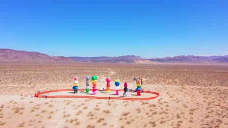 Far-away-counter-clockwise-aerial-drone-view-of-the-7-magic-mountains-in-Nevada