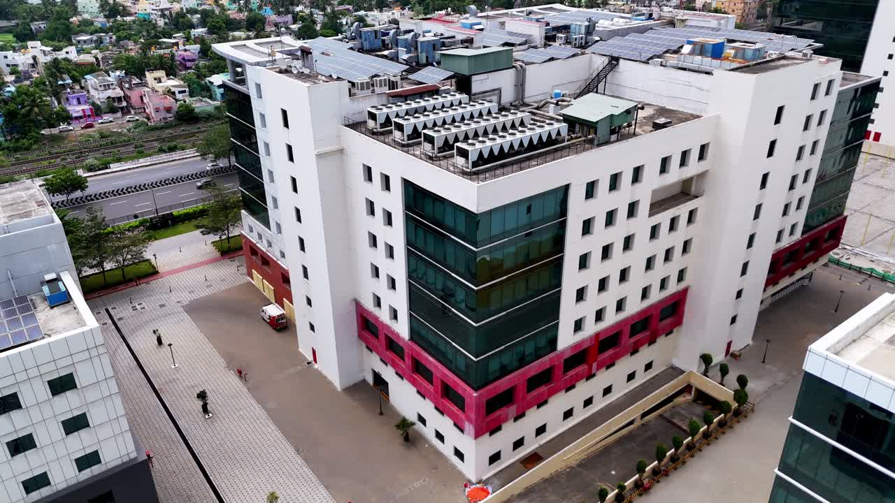 Urban Development Facades: Dynamic footage focusing on the exterior walls of new commercial towers. Highlights the clean lines, color blocks, and reflective windows of the modern business district