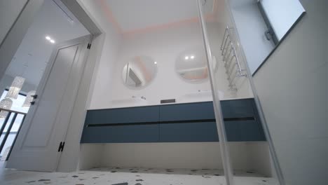 modern tiled bathroom with shower in modern home, real estate interior. wide shot footage